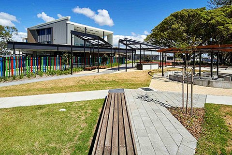 Landscaping and play area of Ballina Coast High School with building in background