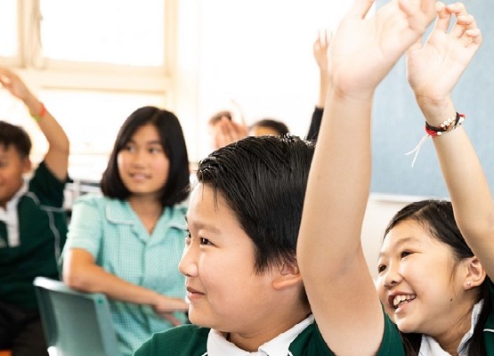 Keen children in classroom