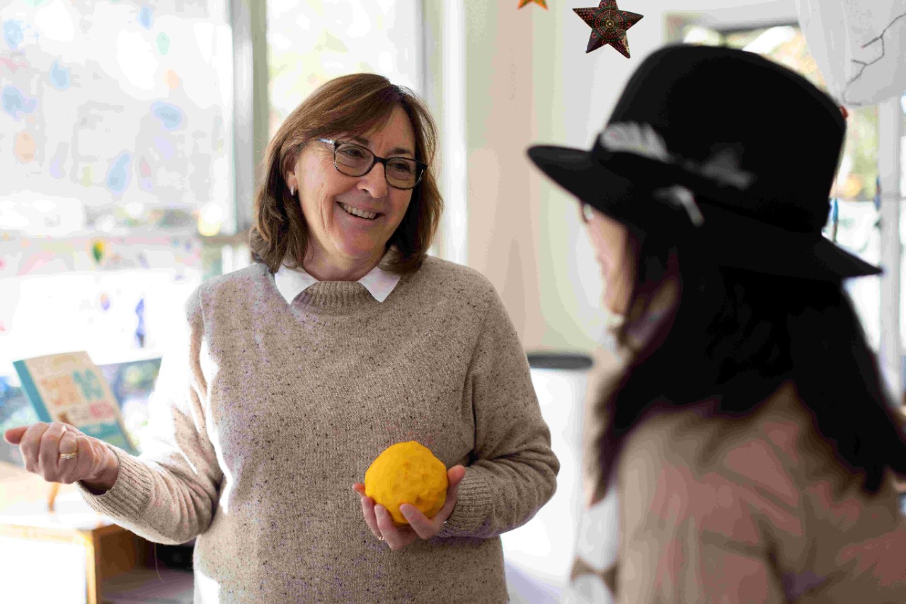 Two female preschool educators speaking with eachother at an early childhood education centre