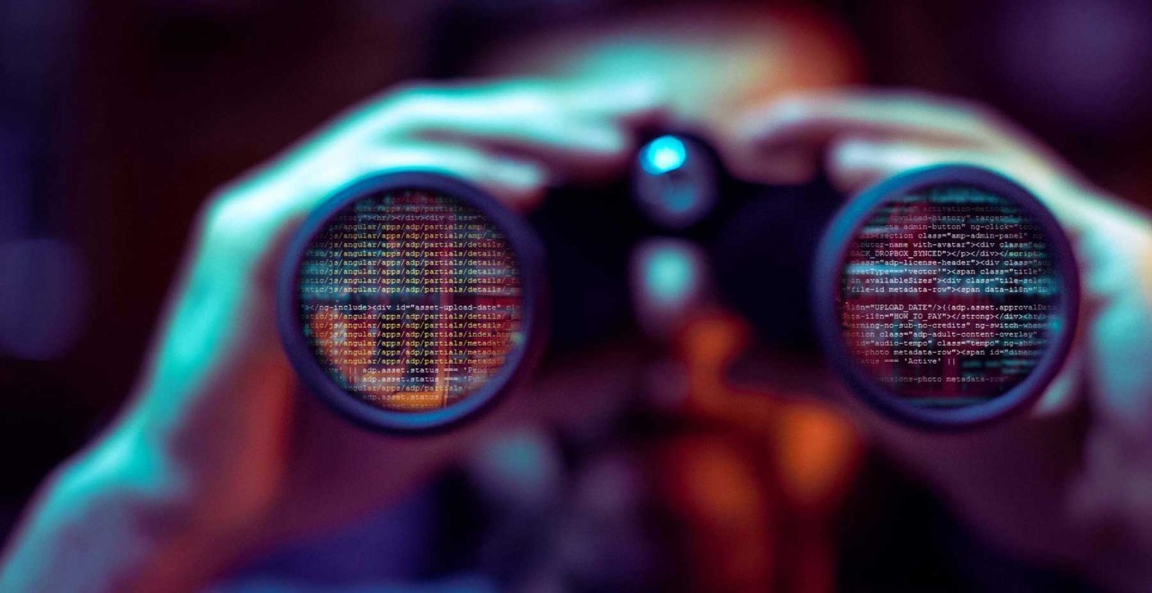 Student looking at HTML code through binoculars