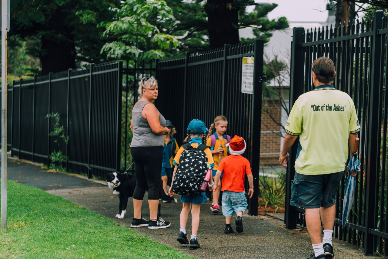 Parents walking children into school