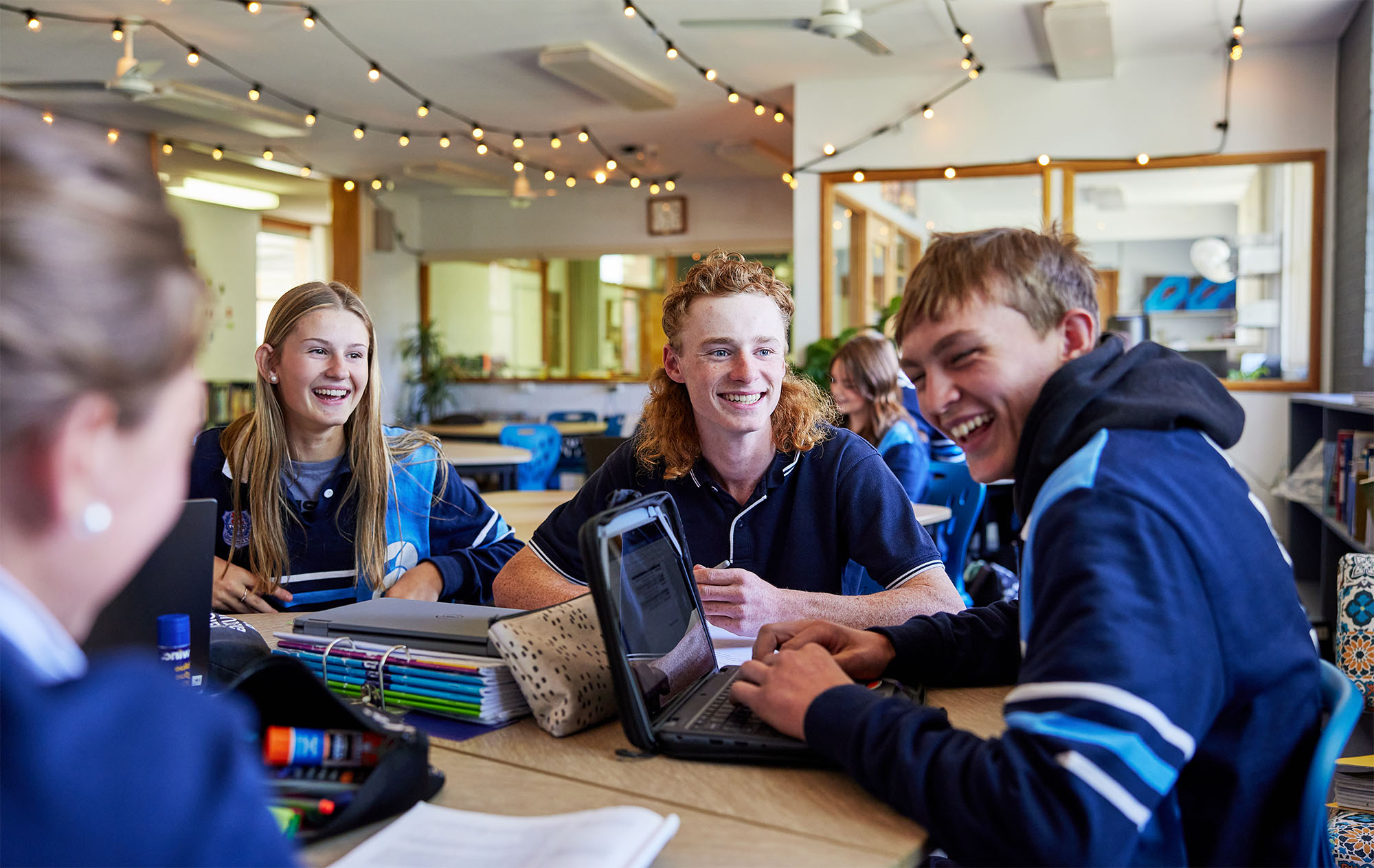 Group of students sitting at a desk