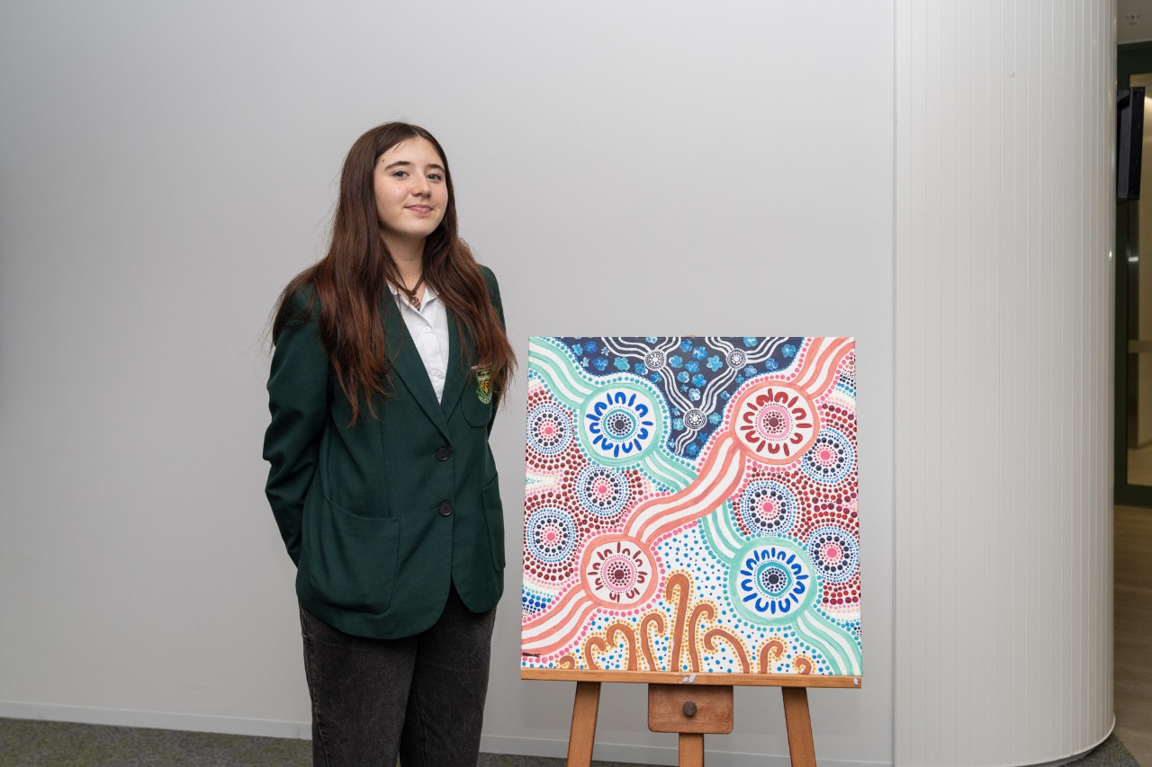 Kayla Maher and her artwork.