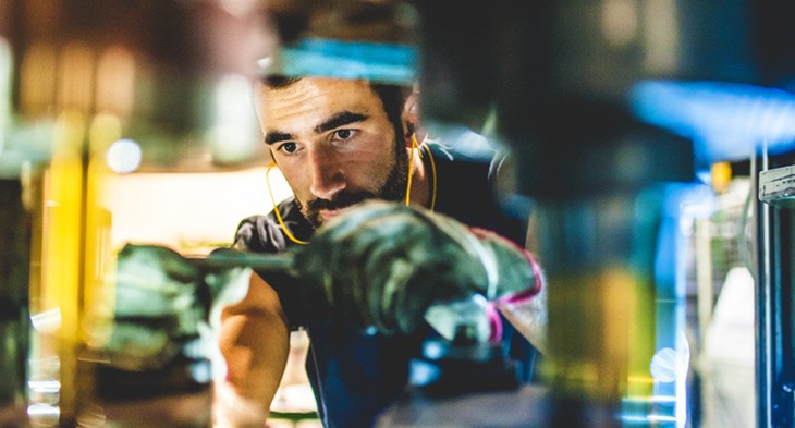 Male electronics student working.