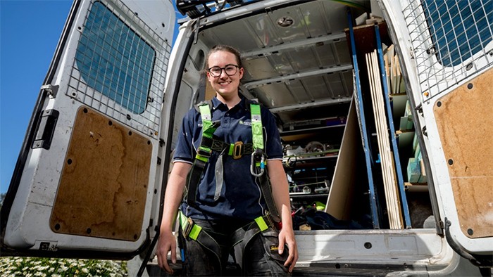 Female apprentice with van.