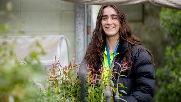 Female agricultural student in nursery.