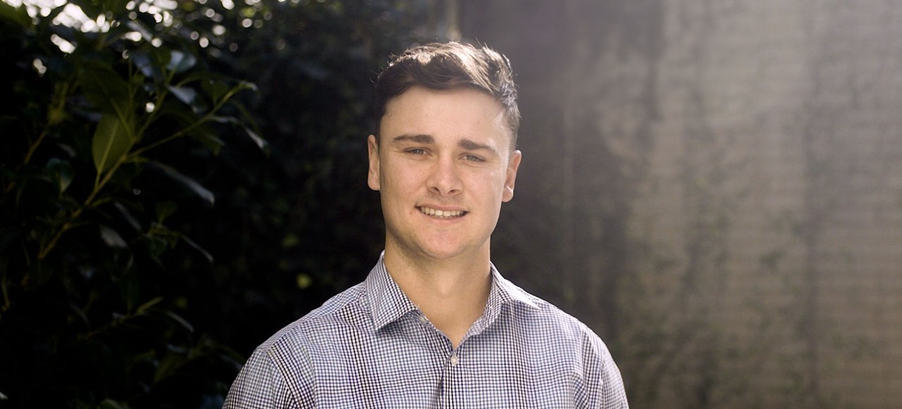Male teacher smiling at camera