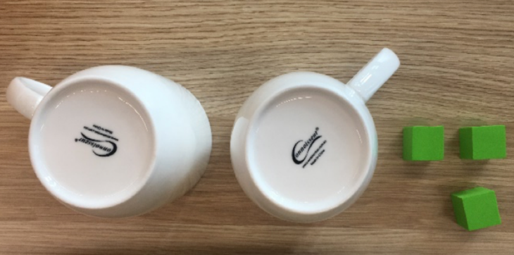 2 upside down cup and 3 blocks on the side