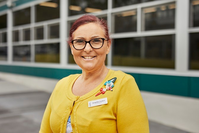 Female teaching standing outside