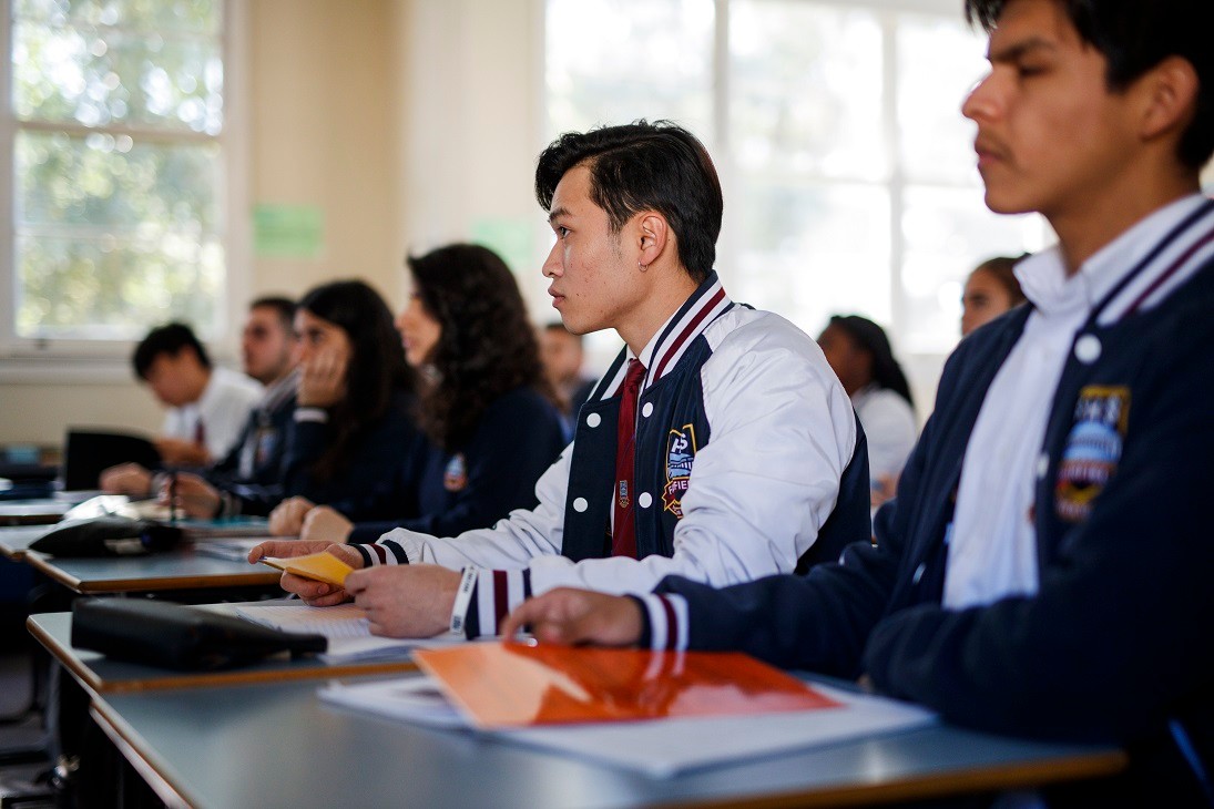  high school students sitting looking forward