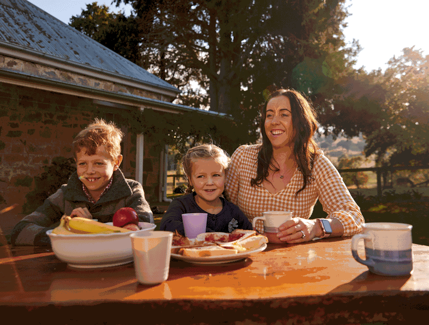 family sitting at an outdoor table