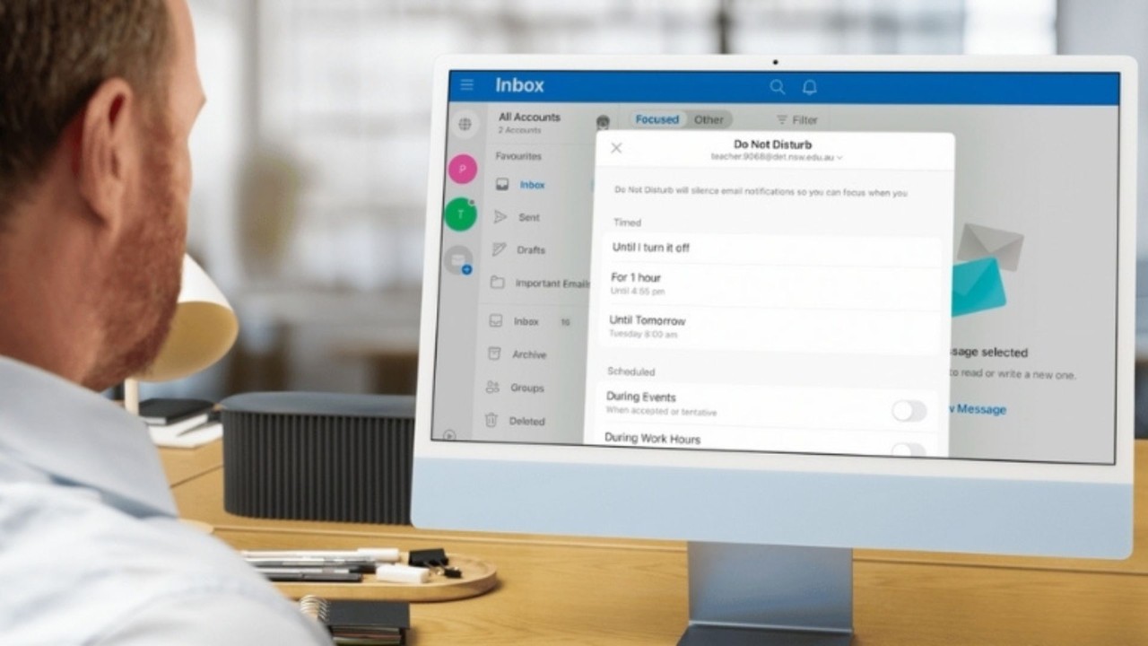 Person looking at a computer monitor with Do Not Disturb settings.