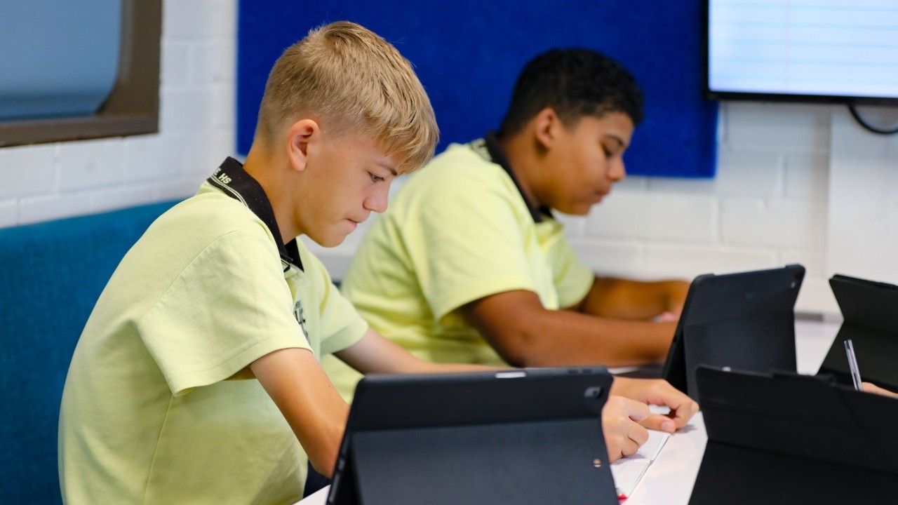 Two students using tablets