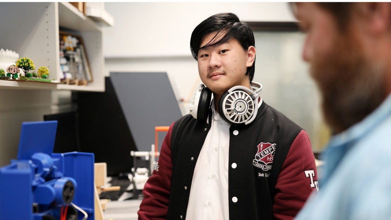 Student smiling at camera