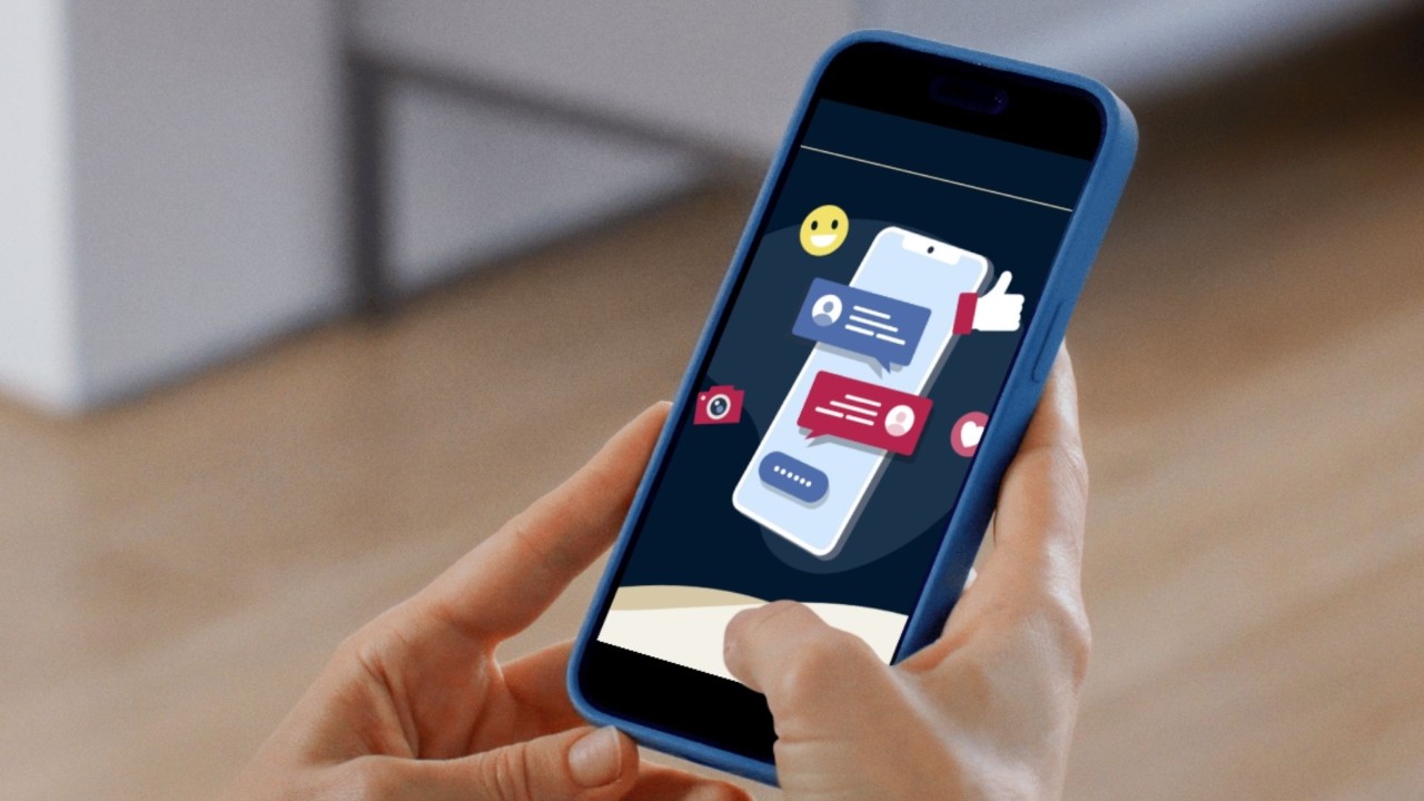 Mobile phone with message bubbles and the words social media age restrictions