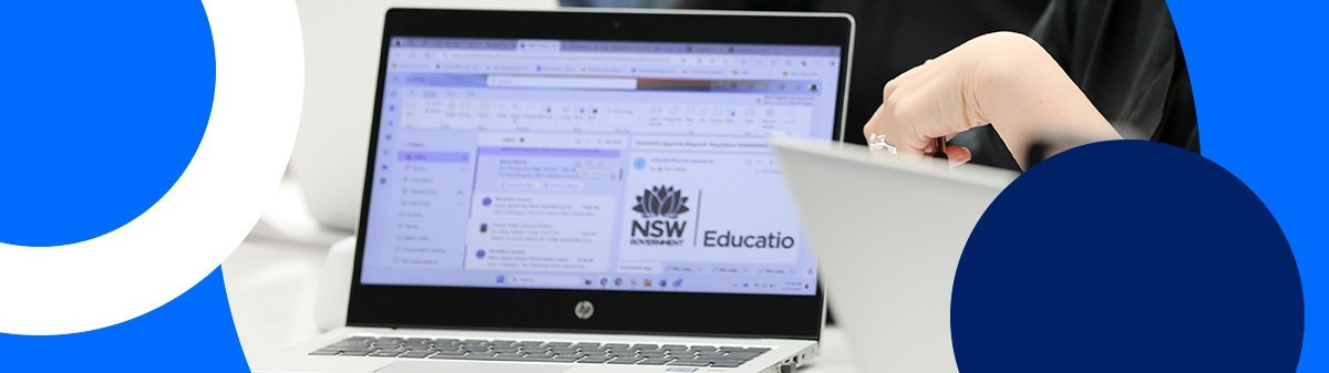 Two ladies looking at a laptop.