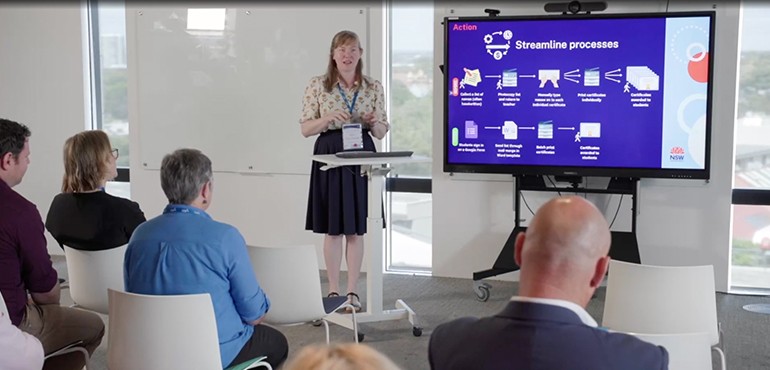 Amy Greenwood in front of smart board