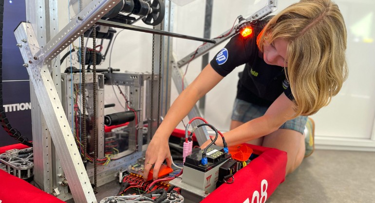 Student with a robot.