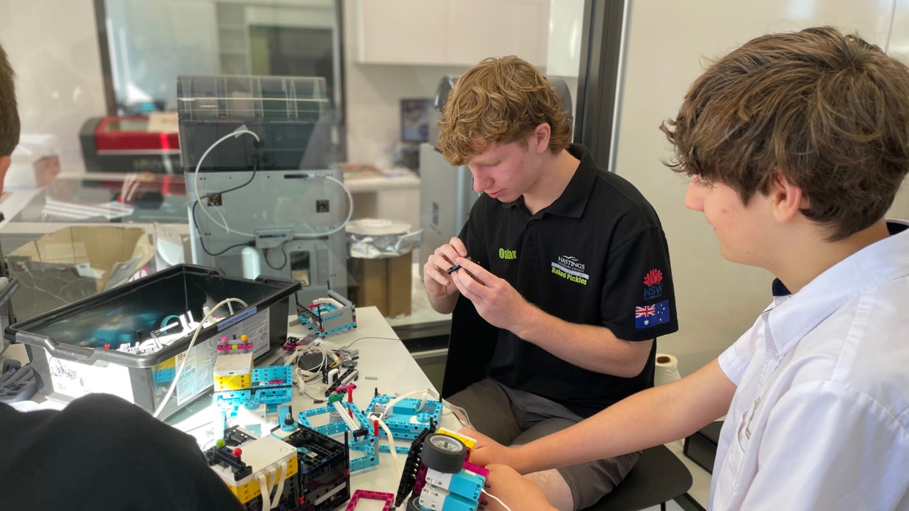 Two students assembling a kit